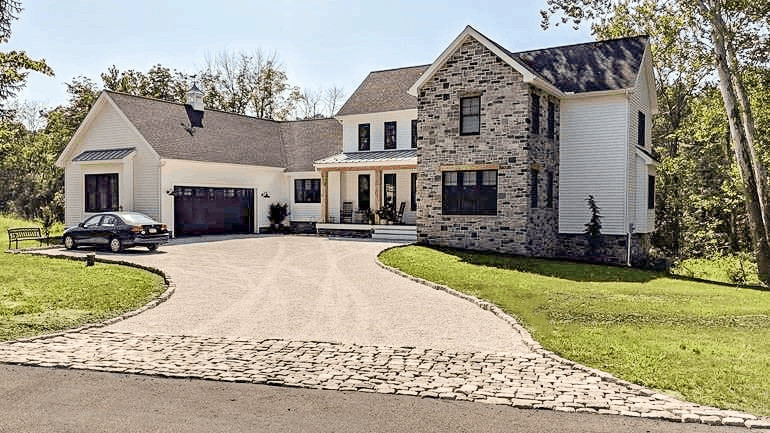 an image of a driveway walkway idea that use stone as a border