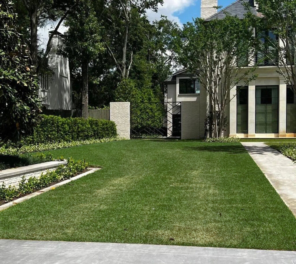 an image of a driveway idea that uses a grass driveway for a natural look