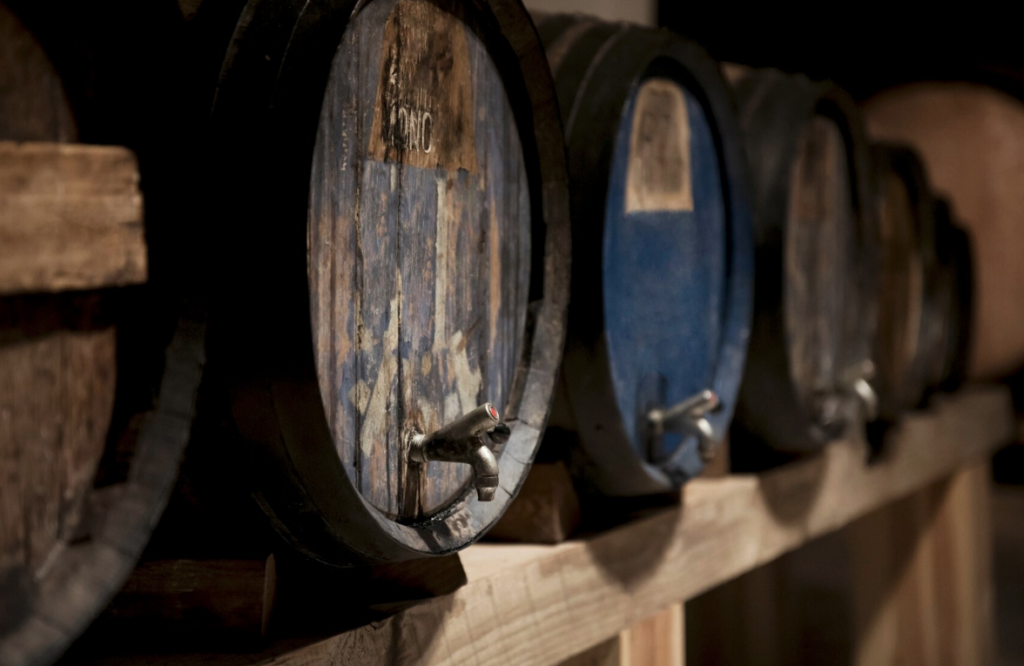 an image of wine barrels used to introduce the next section: “12 Inspired Winery Design Ideas”