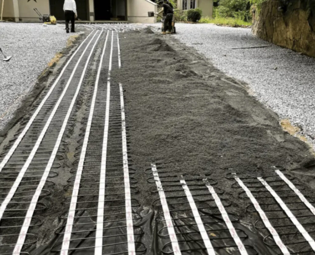 The installation of a heating system in the parking lot. 