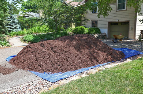 Wood chips piled in the driveway, ready to be spread.