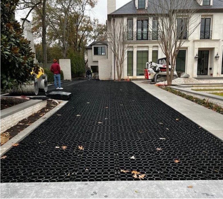 Permeable pavers installed in a driveway outside a home. 