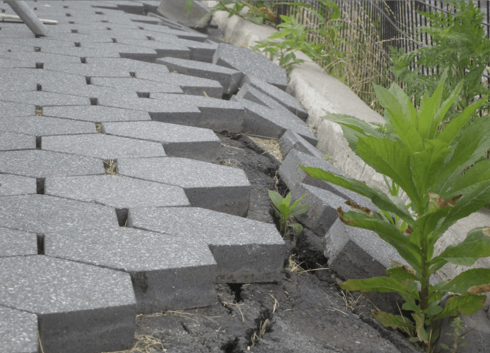 Erosion is causing pavers to shift and fall off the patio.