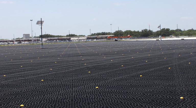 A parking lot equipped with TRUEGRID permeable paving solutions.