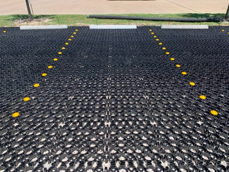 TRUEGRID permeable parking solutions installed in a parking lot. 